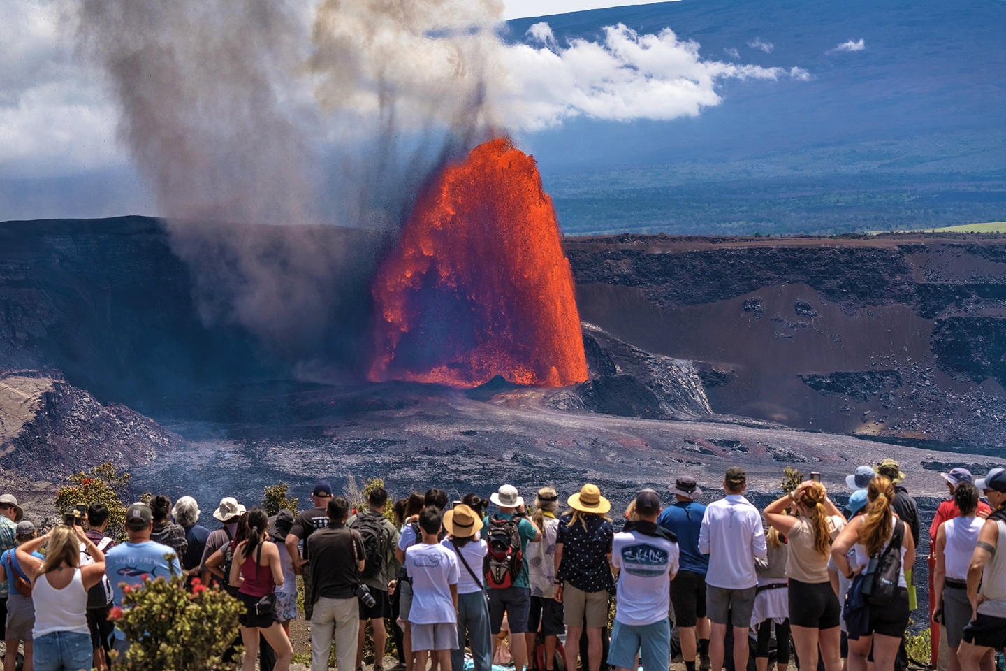 Visitors watching the caldera at Hawaii Volcanoes National Park