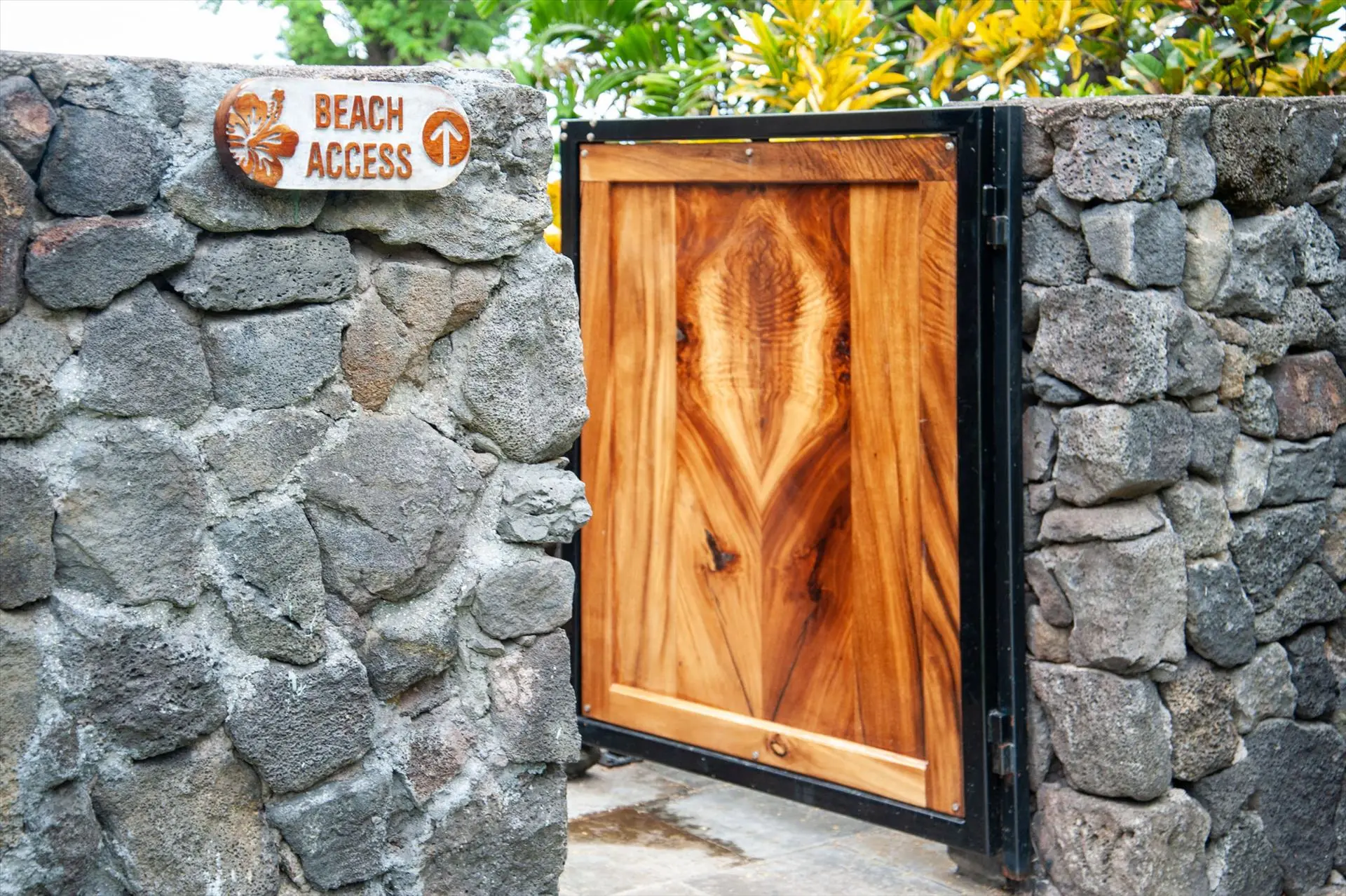 Koa beach access gate in the lava rock wall