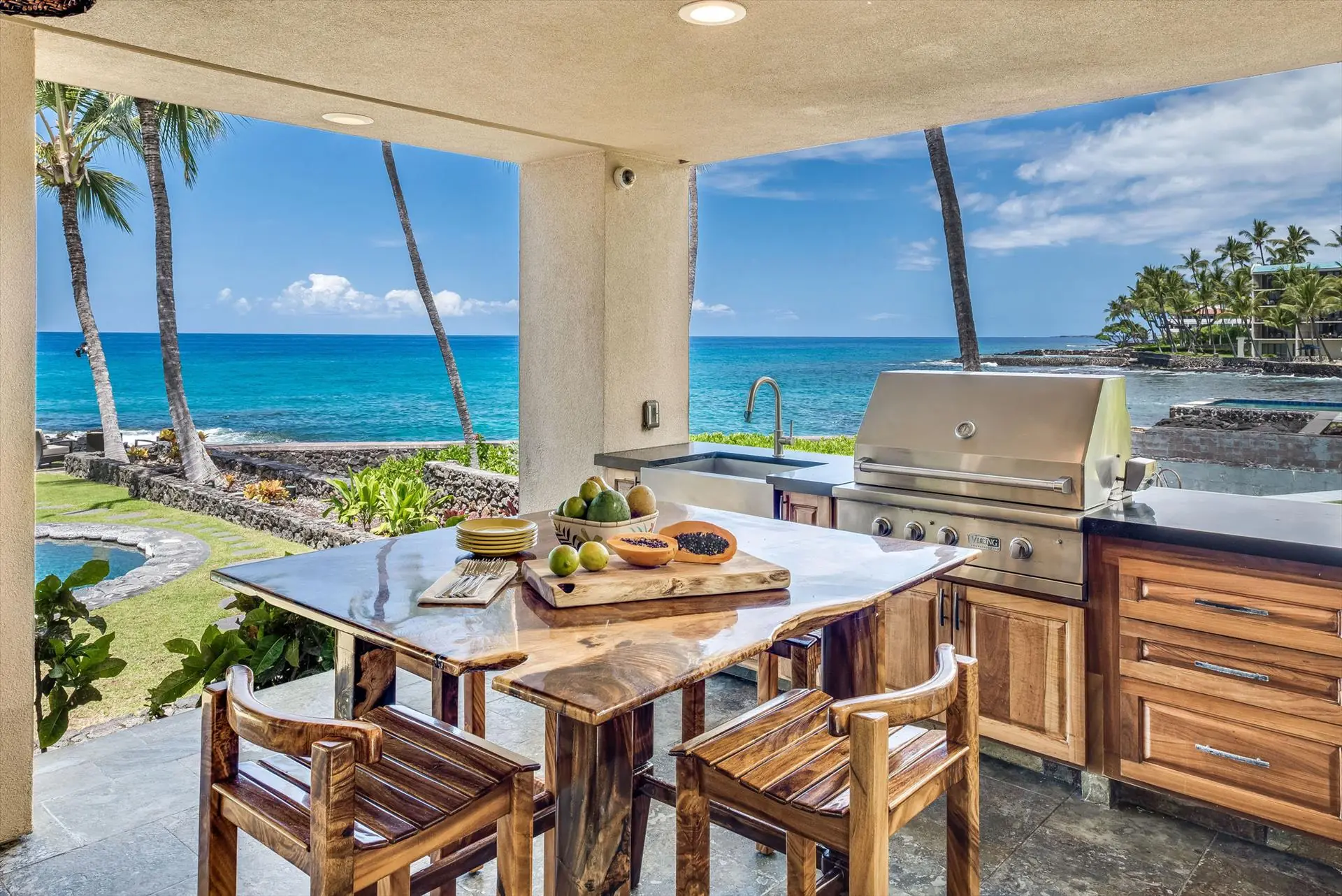 Oceanfront lanai kitchen at Moana Makai with Koa table and Viking grill